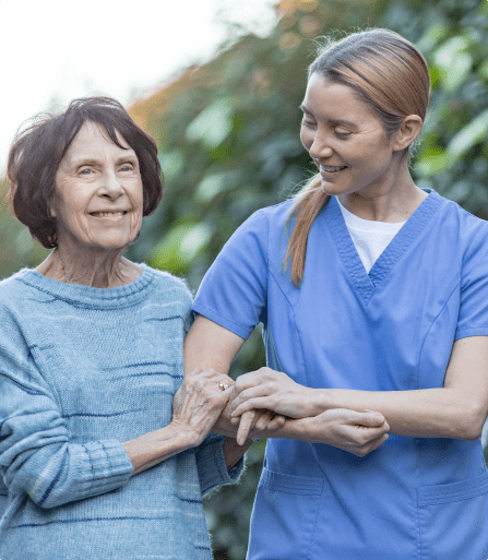 Elderly man looking forlornly out a window.