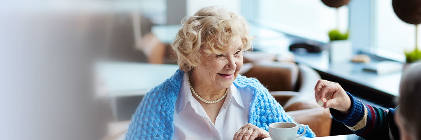 Happy seniors playing a board game